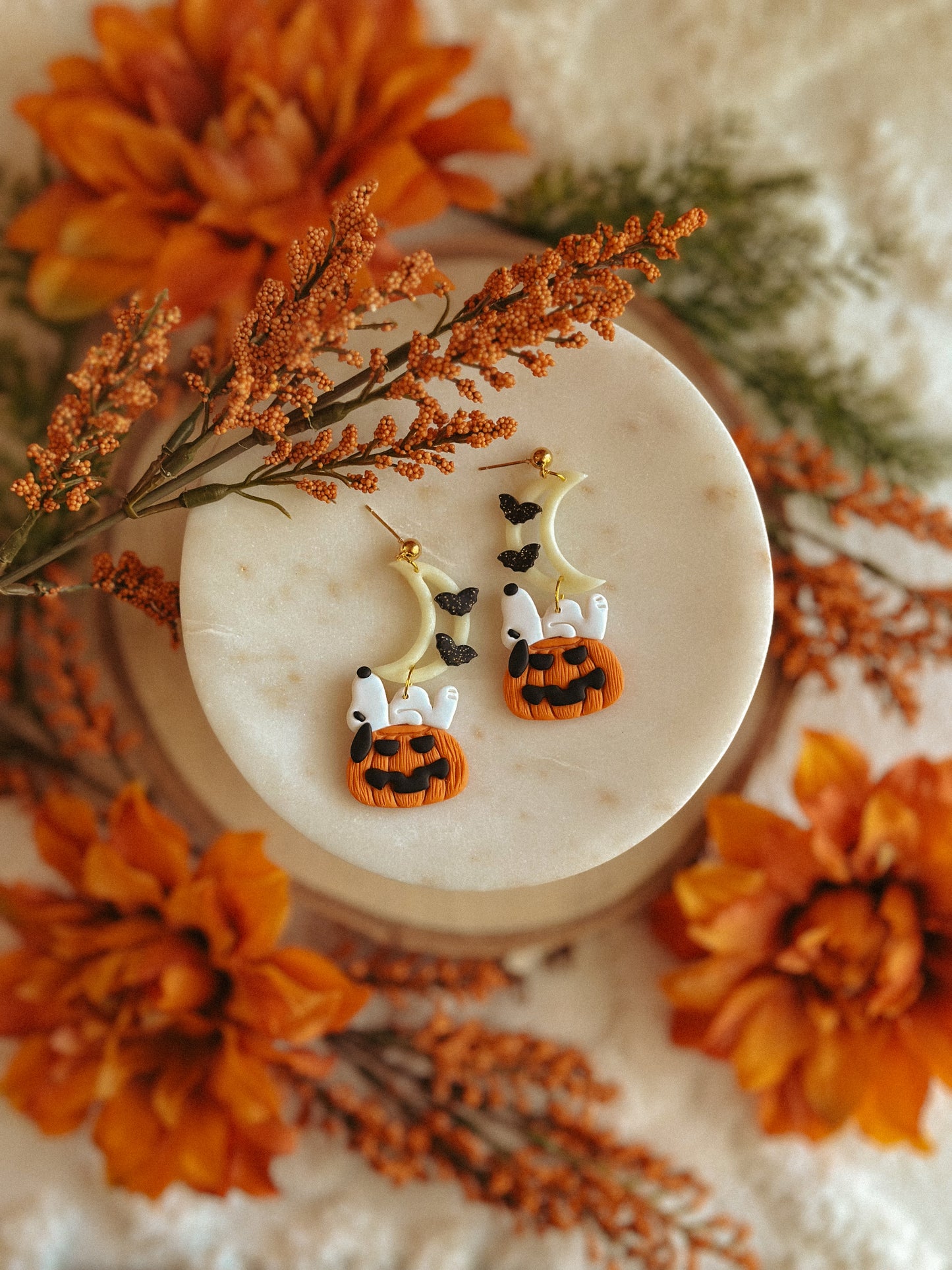 Handmade Snoopy polymer clay moon and pumpkin dangle earrings for spooky season