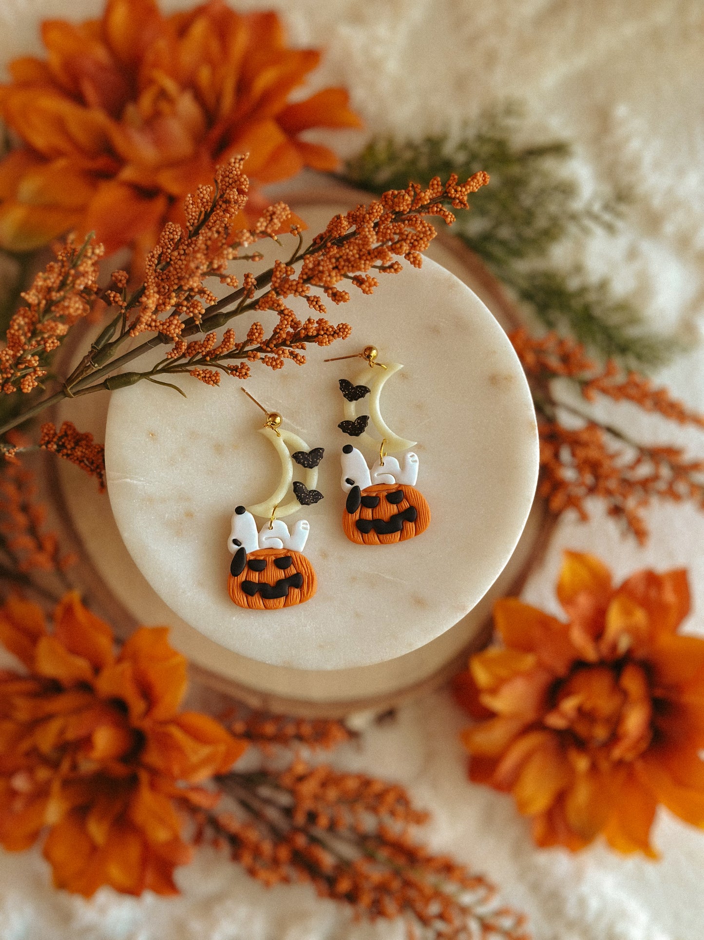 Handmade Snoopy polymer clay moon and pumpkin dangle earrings for spooky season