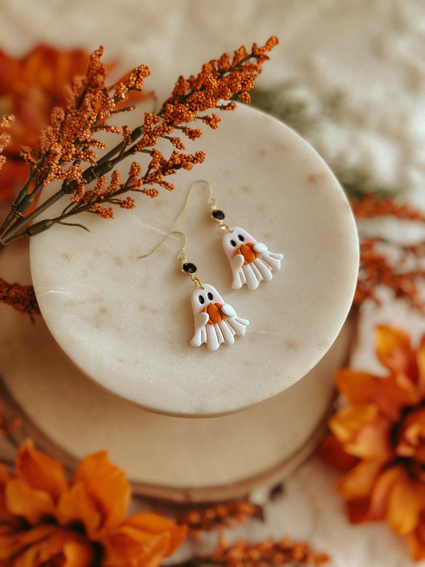 Ghostie holding pumpkin polymer clay dangle earrings for Halloween