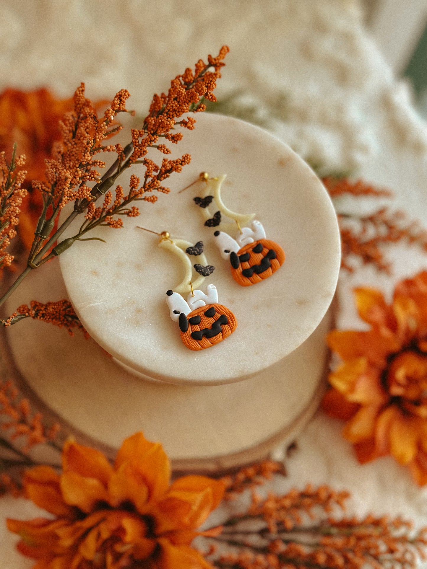 Handmade Snoopy polymer clay moon and pumpkin dangle earrings for spooky season