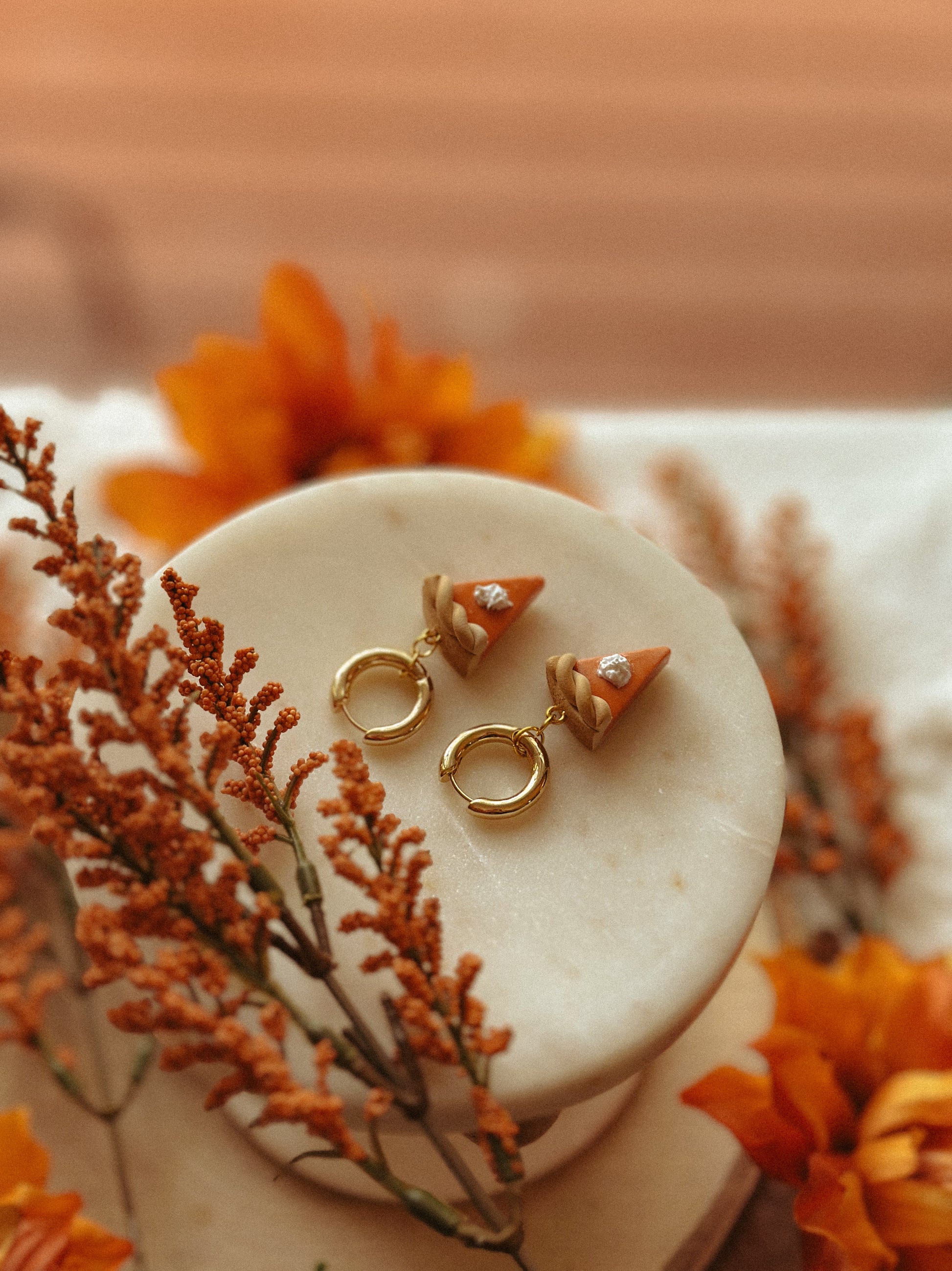 Pumpkin Pie Slice Huggies polymer clay earrings in handmade orange pie design, autumn and fall jewelry