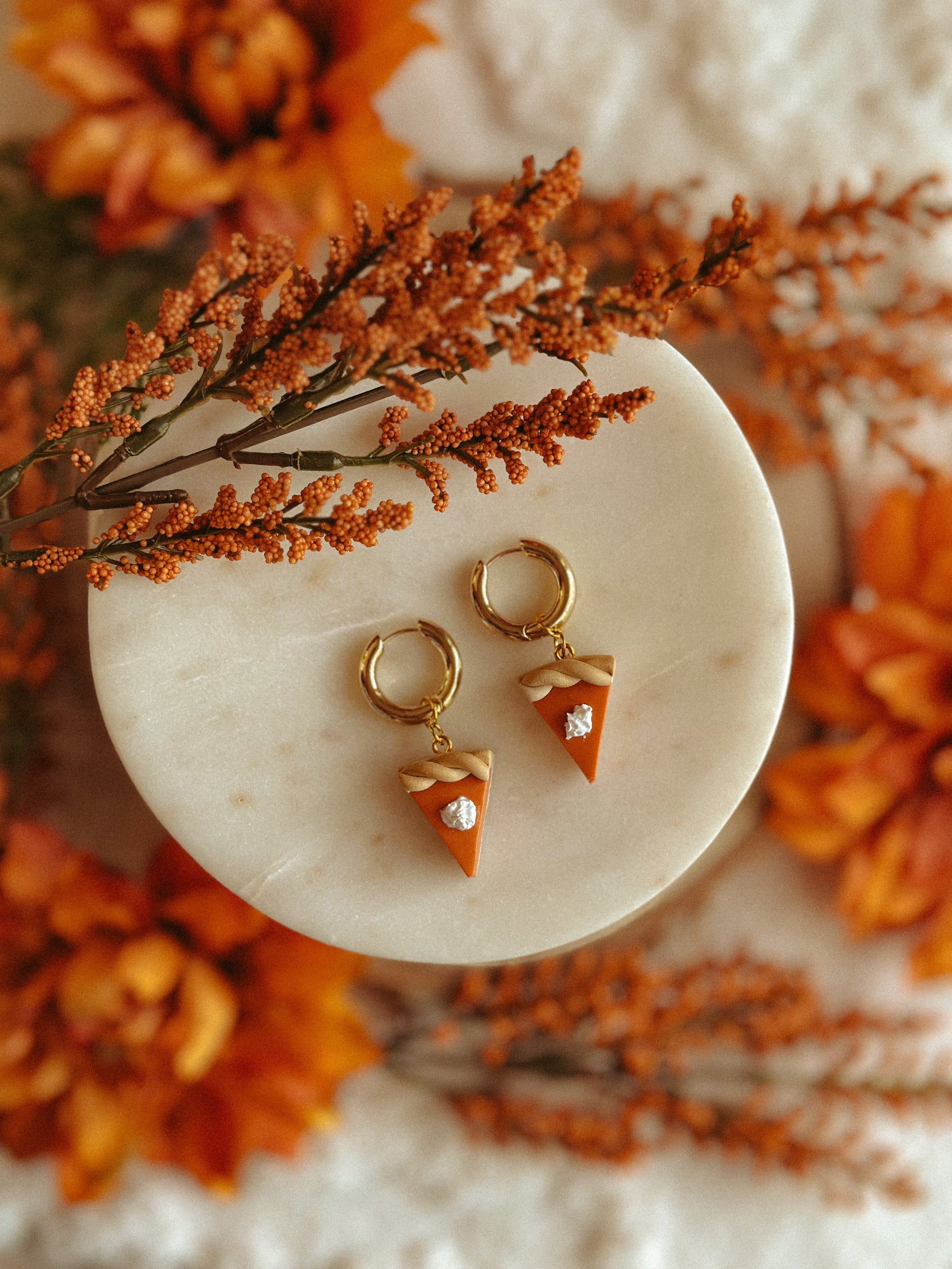 Pumpkin Pie Slice Huggies polymer clay earrings in handmade orange pie design, autumn and fall jewelry
