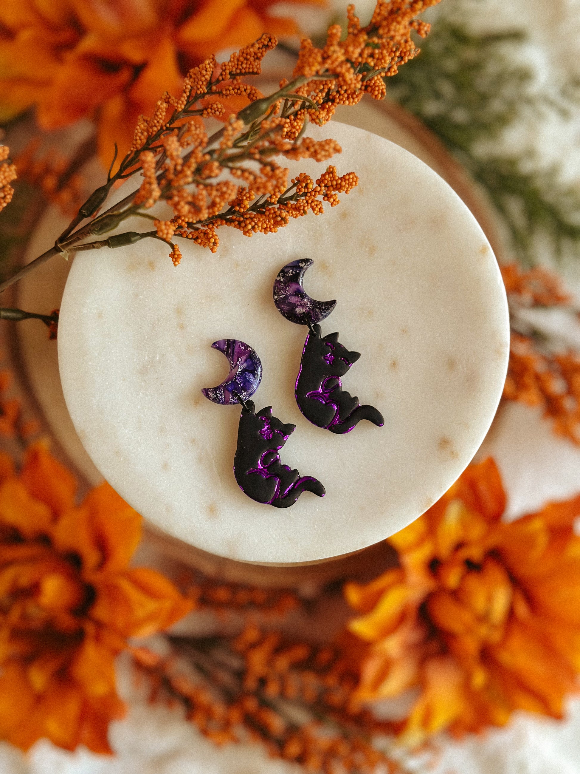 Salem Cat Hanging from the Moon polymer clay earrings black cat and crescent moon design