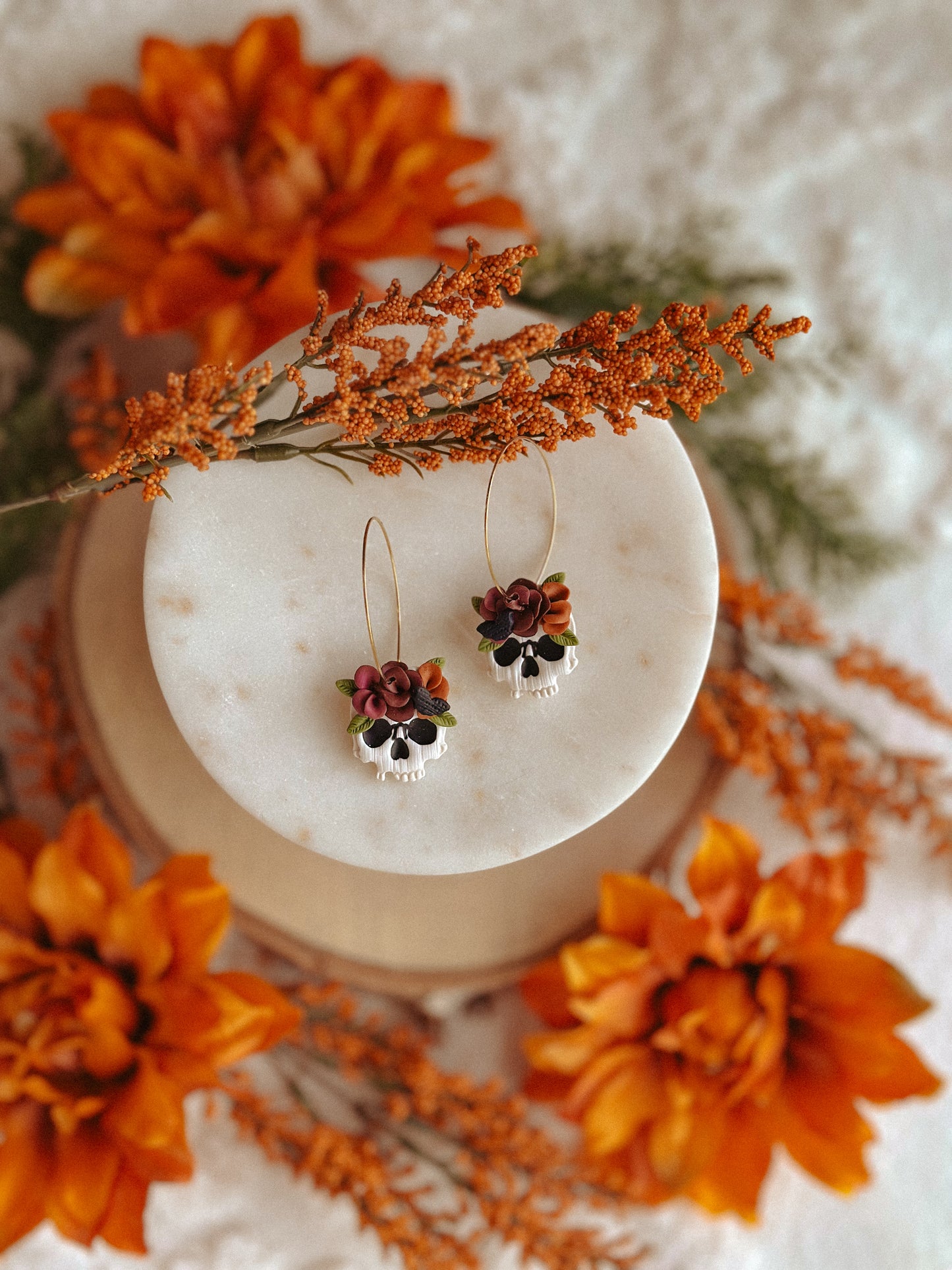 Autumn floral skull hoop polymer clay earrings skull with flower accents