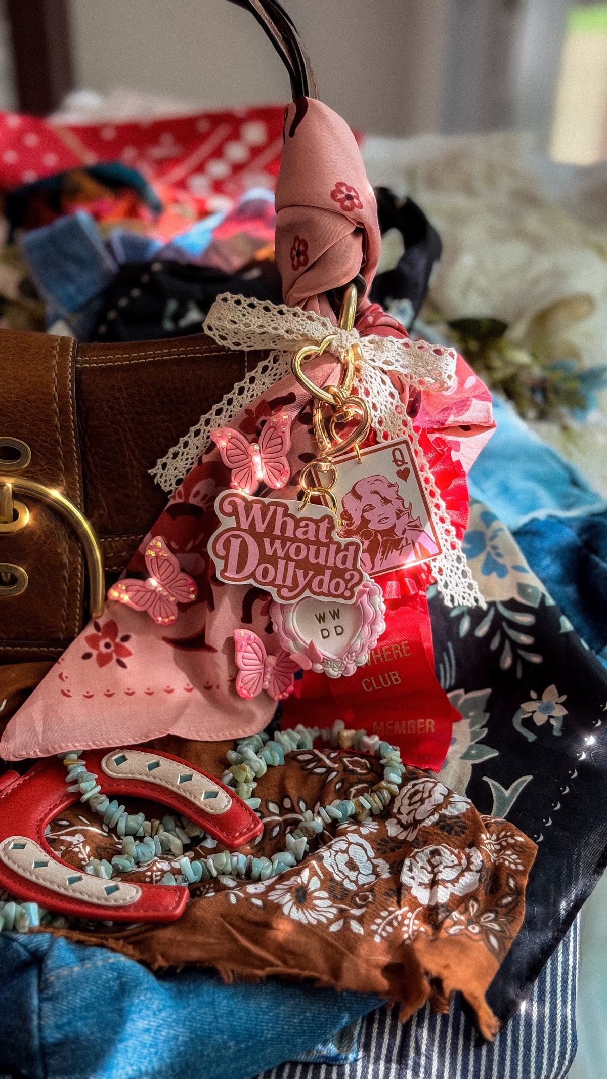 What Would Dolly Do Dolly-inspired purse charm with gold heart clasp, pink scarf, lace ribbon and butterfly accessories