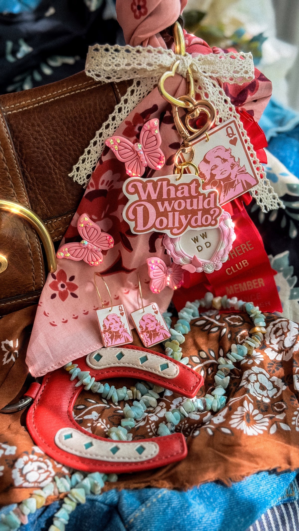 Queen Dolly card earrings displayed with Dolly Collection bag charms, butterflies and colorful western accessories