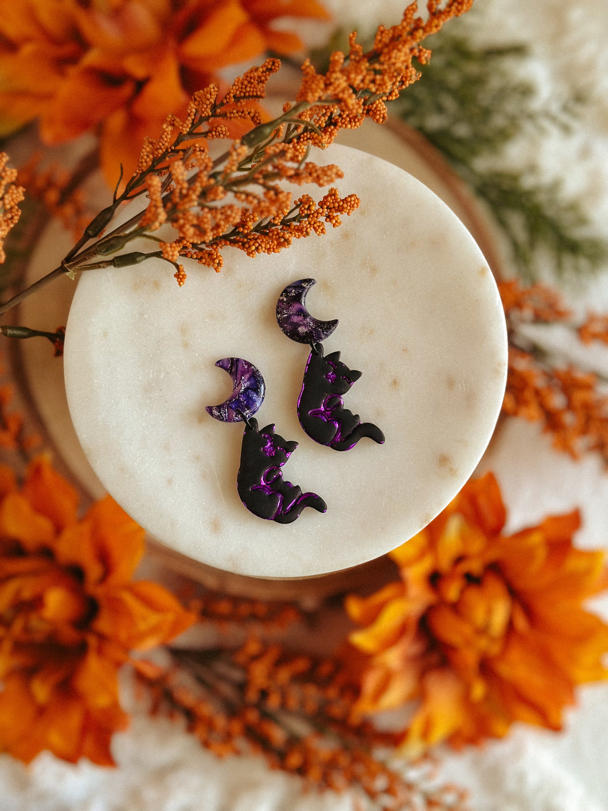 Salem Cat Hanging from the Moon polymer clay earrings black cat and crescent moon design