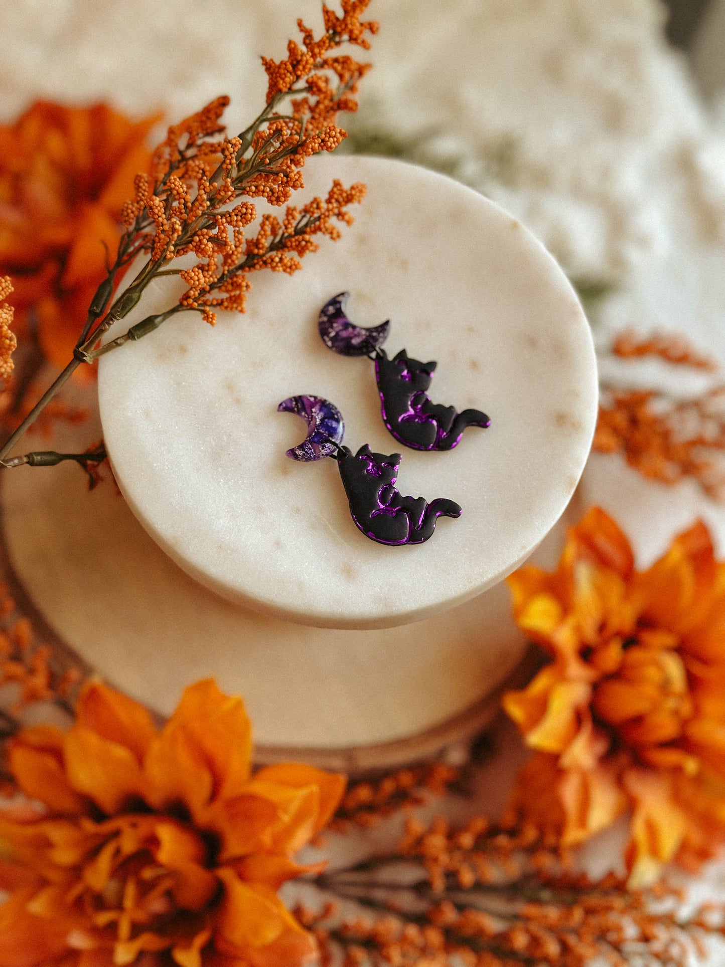 Salem Cat Hanging from the Moon polymer clay earrings black cat and crescent moon design