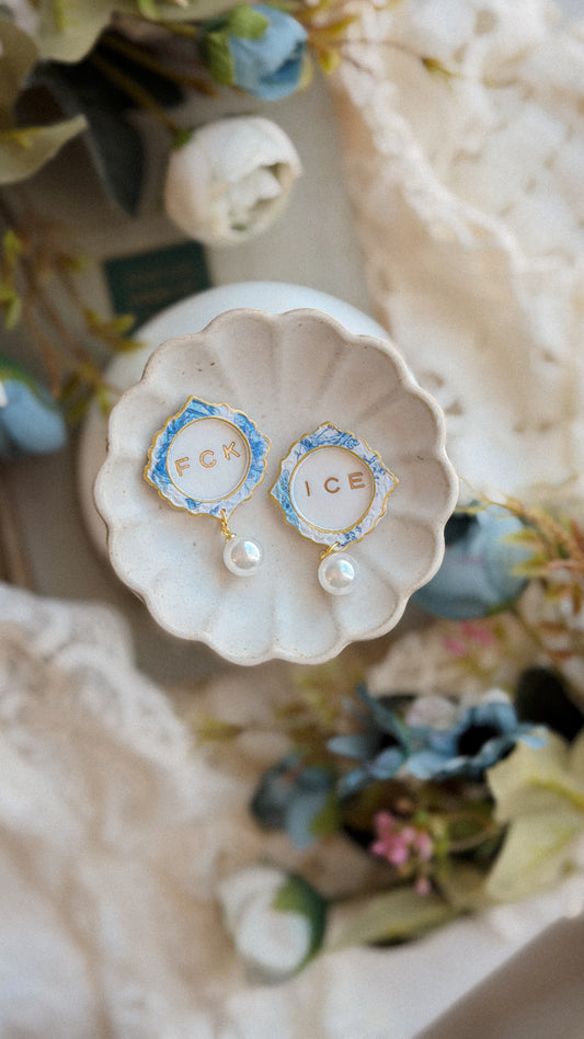 Handmade polymer clay stud earrings Fck Ice Chinoiserie Frame Pearl Stud Earrings with classic pearl center — elegant statement studs on white background