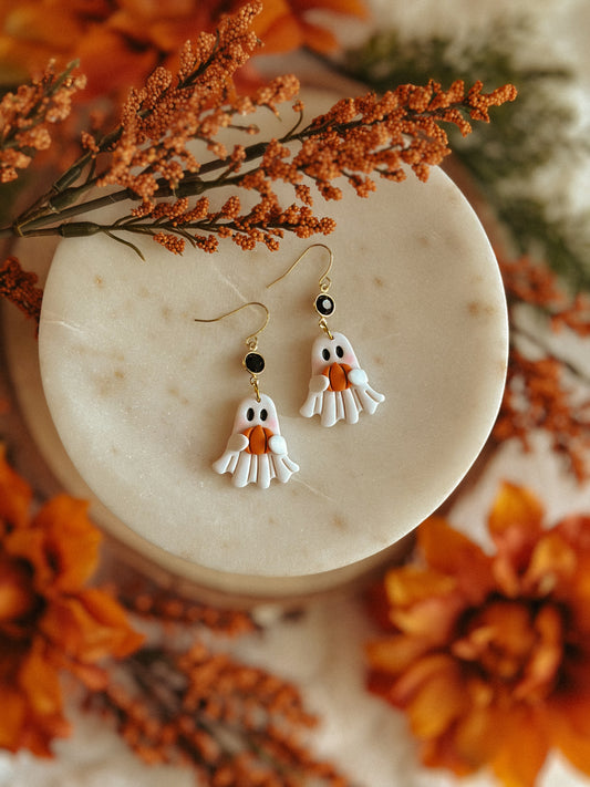 Ghostie holding pumpkin polymer clay dangle earrings for Halloween