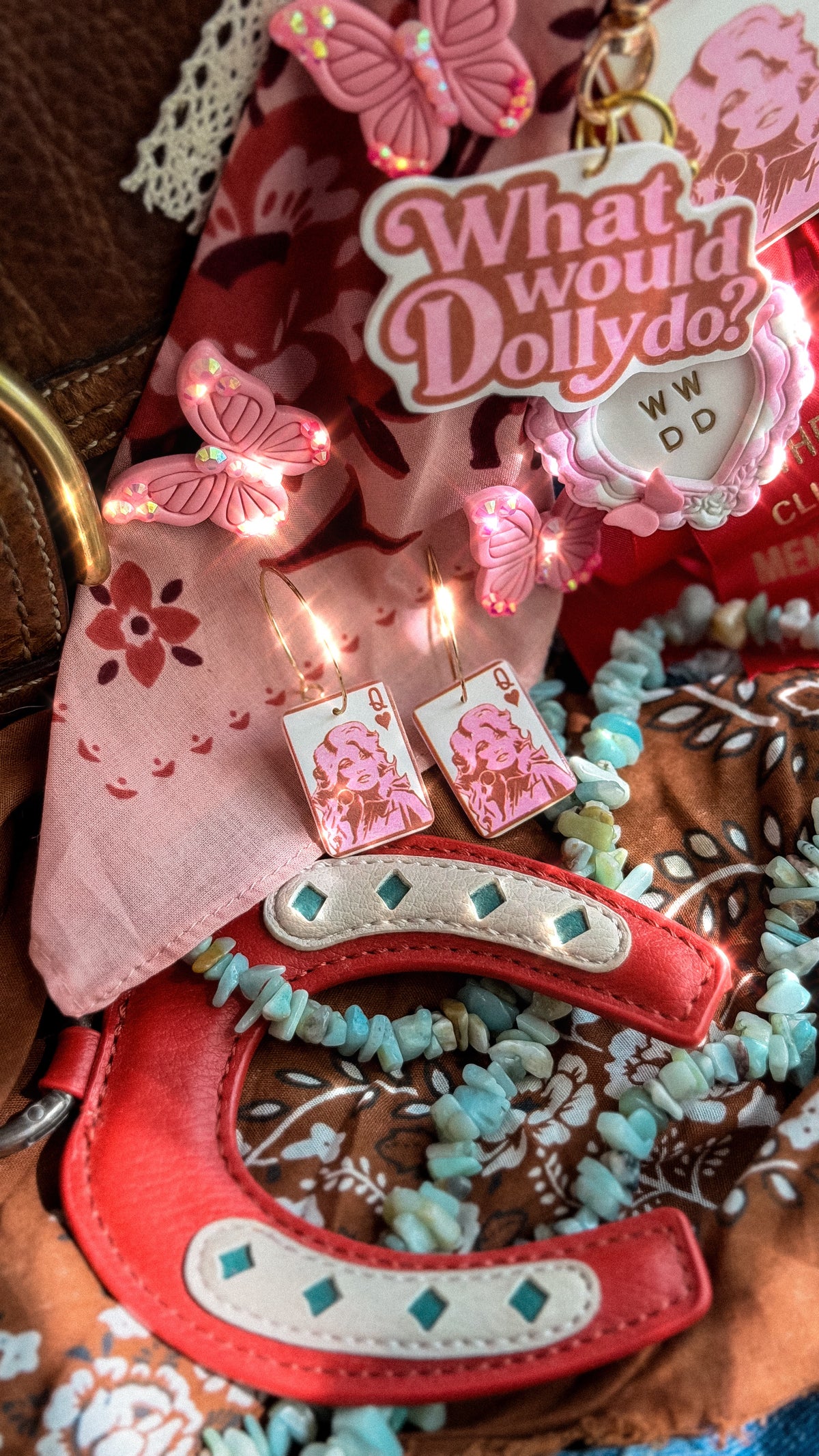 Queen Dolly playing card earrings in pink and cream styled with What Would Dolly Do charms and rhinestone butterflies