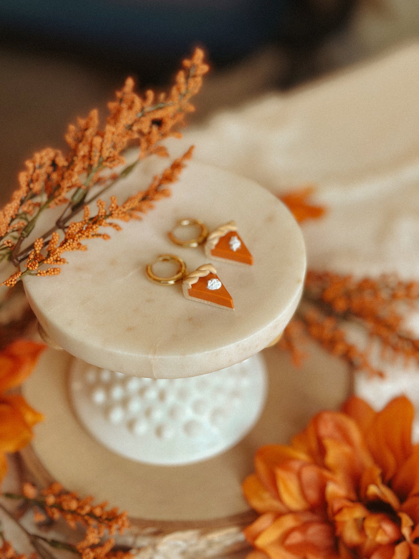 Pumpkin Pie Slice Huggies polymer clay earrings in handmade orange pie design, autumn and fall jewelry